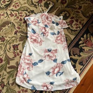 White floral dress halter style. Straps on either side of neck